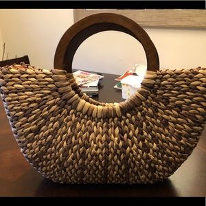 Large woven straw bag with wood handles